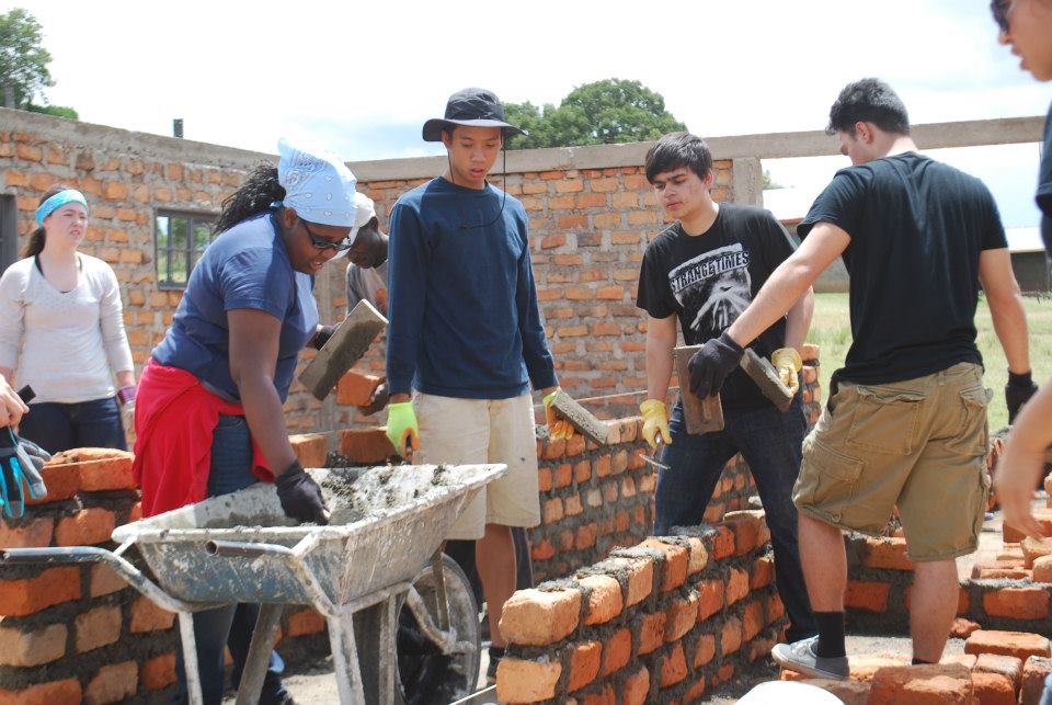 Volunteers and community members working together on a local project near Mara West